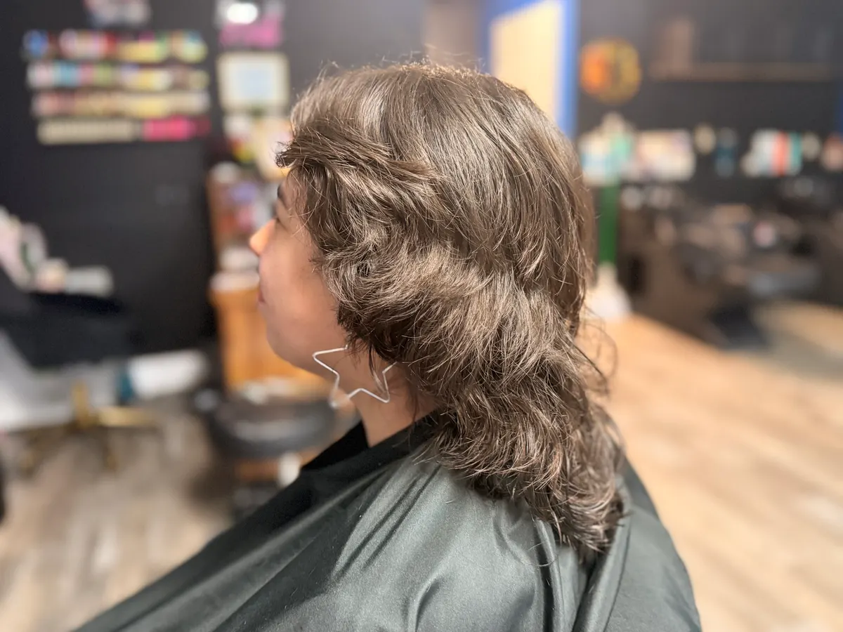 Textured layered wolf cut with a star earring, by Asher